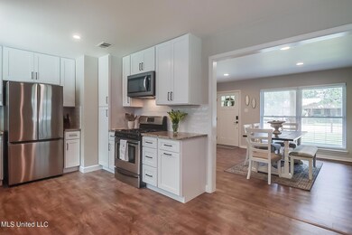 Kitchen opening into dining