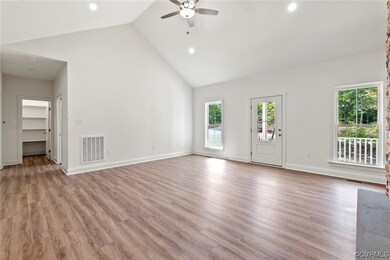 The family room also offers a vaulted ceiling and