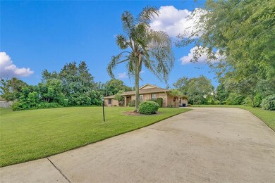 Long curved driveway leads to a 2-Car Garage!