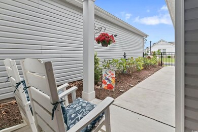 View of patio featuring fence