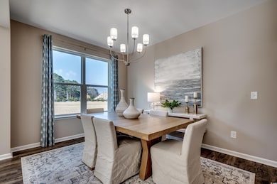 Dining area featuring dark hardwood / wood-style f