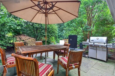 View of patio featuring outdoor dining space and a grill