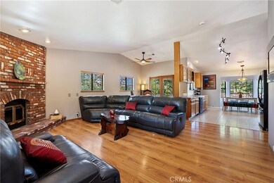 The living room seamlessly connects to the kitchen and dining space thanks to the open concept design.