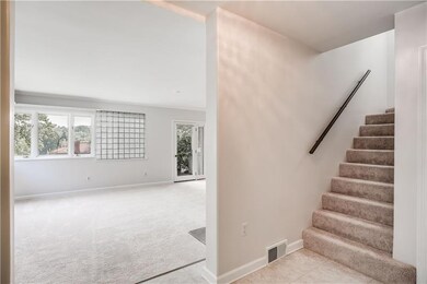 9x9 foyer with rounded corner walls, poured concre