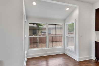 Unfurnished dining area with lofted ceiling, base