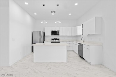 Kitchen with appliances with stainless steel finis