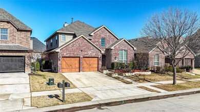 Front of property featuring a garage and a front l