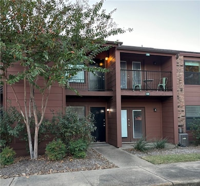 View of front of property featuring a balcony and