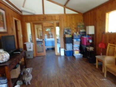 LIving room with doors leading to master