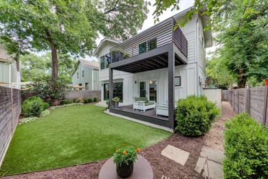 Rear view of house featuring french doors, board 