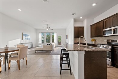 Kitchen featuring appliances with stainless steel
