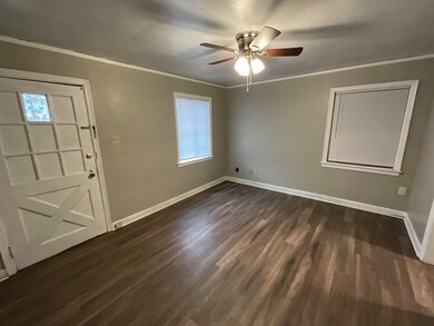 Entrance foyer featuring ceiling fan, baseboards, 