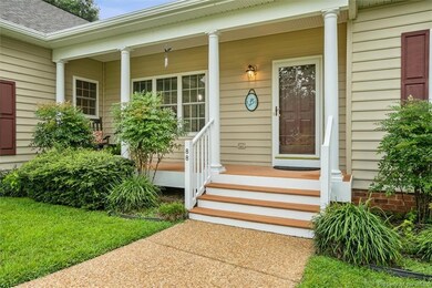 A lovely aggregate driveway and sidewalk lead you in.
