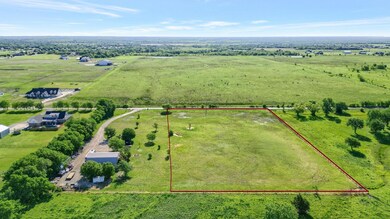 Birds eye view of property featuring a rural view