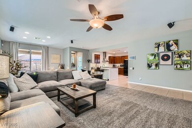 Living room with light tile patterned floors, ceil