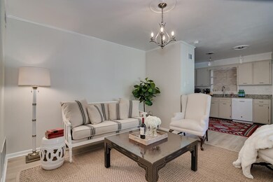 Sitting area open to the kitchen and foyer