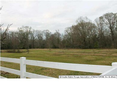 Picket fence around the house then another fence a