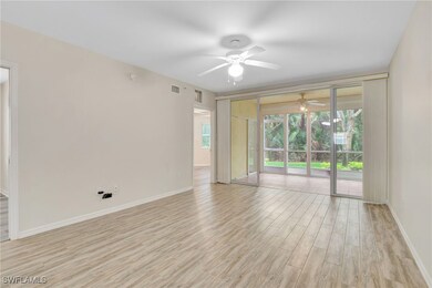 Empty room featuring ceiling fan, light wood-type