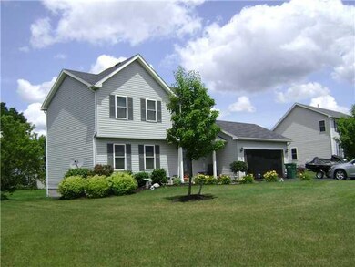 Exterior Front Side view accenting the mature tree