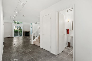 Entrance foyer with guest bath at right.