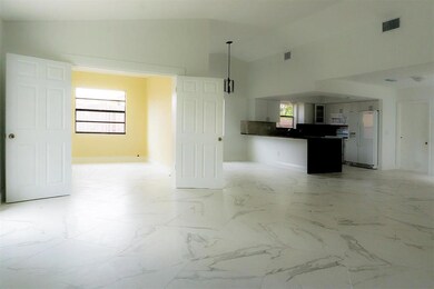 Great room looking at Den and Kitchen