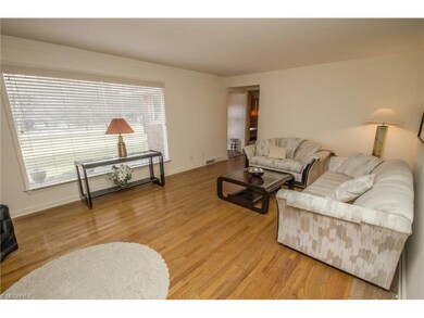 Formal living room with fireplace and hardwood flo