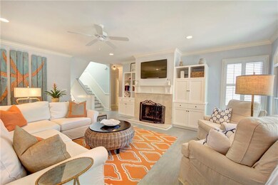 Great room looking toward foyer and stairs to uppe
