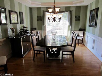 Dining Room - Formal Dining Room is the perfect Room for Entertaining or those Special Family Dinners. Multi-Member Tray Ceiling, Picture Frame Molding and Multi-Member Chair Rail. New Light Fixture is an Elegant Addition.