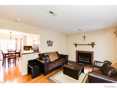 The living room is spacious and features the gas f
