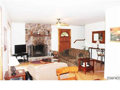 Roomy living room with gorgeous stone fireplace