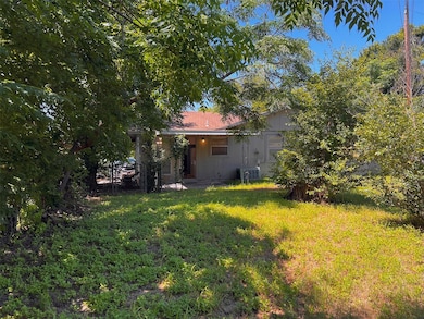 Rear view of property with a patio area and a yard