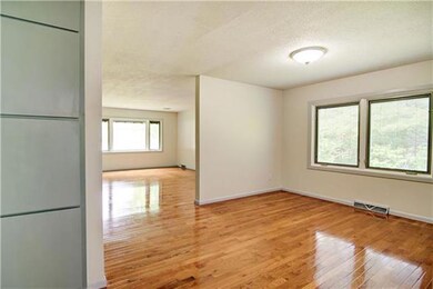 The hardwood floors flow flawlessly into the dinin