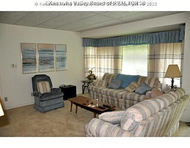 Exterior Front. LARGE LIVING ROOM WITH LOTS OF NAT