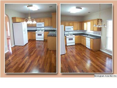Kitchen has ample cabinets, a pantry (out of shot)