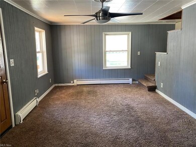 natural light, ceiling fan and crown molding.