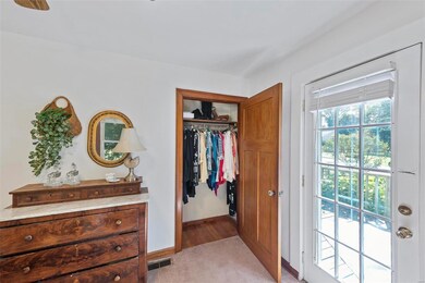 Hardwood floors throughout living room and both bedrooms.