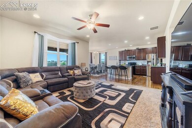 The Living Room flows effortlessly into the Dining Area and Kitchen.