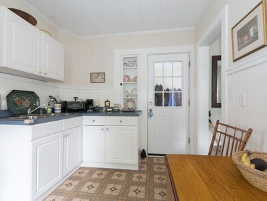 Tiled kitchen includes overhead...