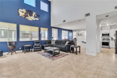 Living room featuring light tile patterned floors,