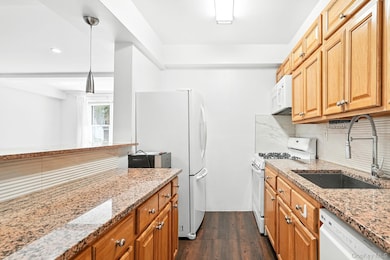 Kitchen with granite countertops.