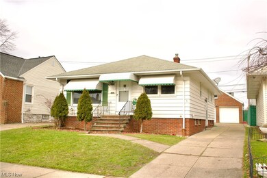 Bungalow-style home featuring a front lawn