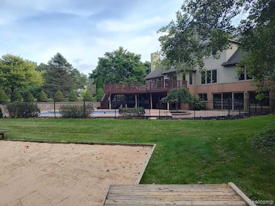 View of yard with a wooden deck, a patio, stairway, and view of scattered trees