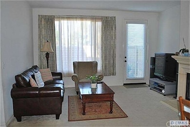 Family room with a door that goes to the back yard