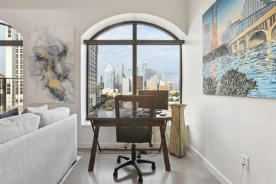 Office with finished concrete flooring, a skyline