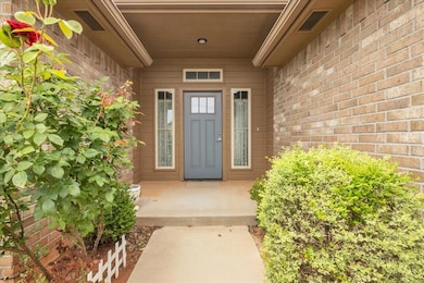 Property entrance featuring brick siding