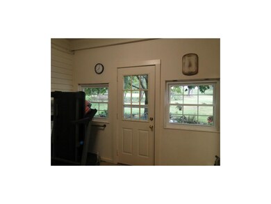 Laundry Room has windows and door to back yard.