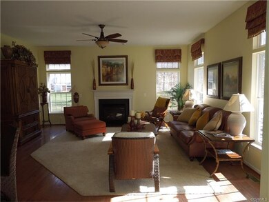 Open and airy living room with hardwood floors, ga
