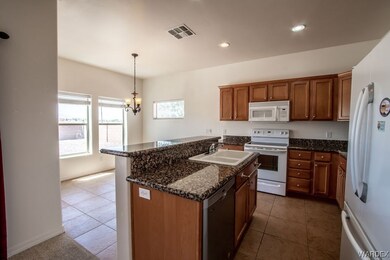 Kitchen with electric range oven, microwave, dishw