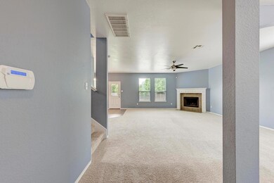 Unfurnished living room featuring light carpet, c
