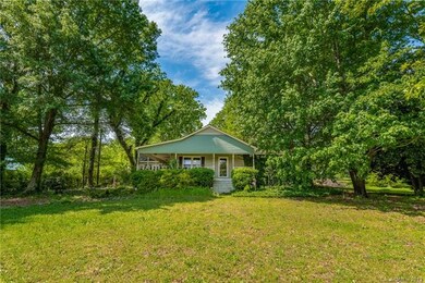 Front of home with Lshape wrap around porch